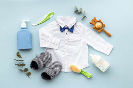 Bodysuit shirt and shoes for baby boy. Baby flat lay backgroundの写真素材