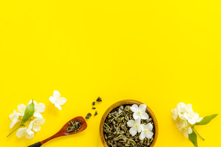Jasmine flowers with dry tea in bowl. Top viewの写真素材