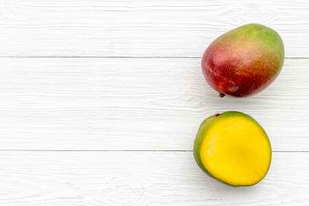 Mango fruits and slices. Tropical fruits backgroundの写真素材