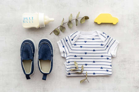 Baby shirt bodysuit with bottle of milk and kids accessoriesの写真素材