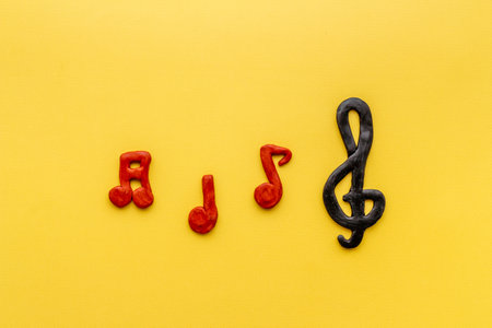 Abstract music notes made of rubber, top view. Music backgroundの写真素材
