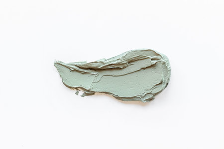 Texture of cosmetic clay mask isolated on white