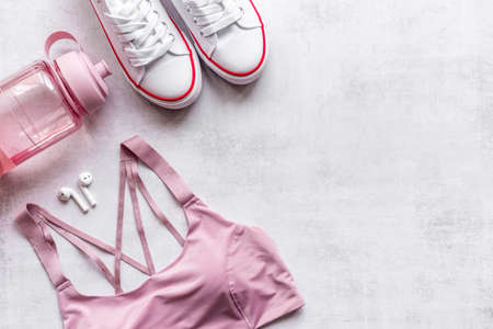 Athlete set with female clothing and sport shoes, top viewの写真素材