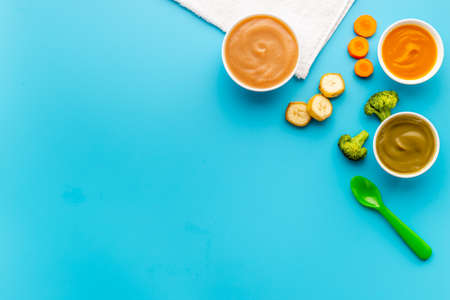 Baby food and milk bottle with kids accessories and toysの写真素材