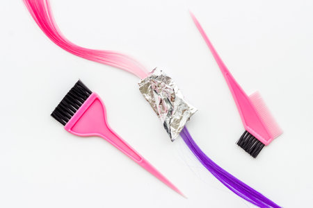 Hairdresser tools for hair dye - brush and strand of hairの写真素材