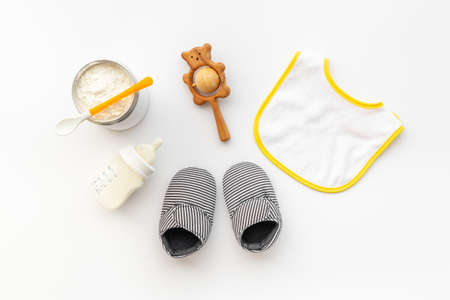 Baby milk in bottle with toy and powdered milkの写真素材