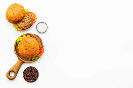Homemade burgers on serving board. Fastfood meal backgroundの写真素材