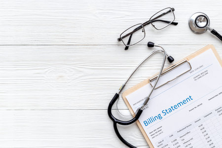 Bill from the doctor with stethoscope. Payment for hospital serviceの写真素材