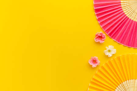 Top view of two hand fans made of bamboo and paperの写真素材