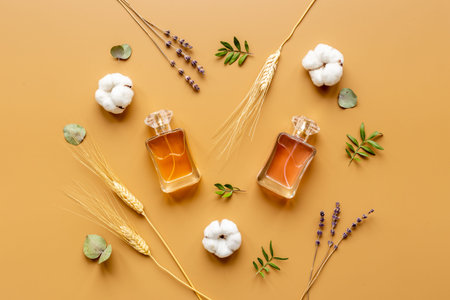 Floral flat lay with perfume bottle, top view