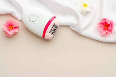 Hair remover epolator on silk - for gentle depilationの写真素材
