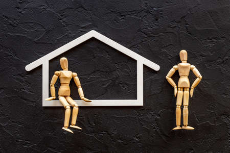 Family concept. Couple of wooden figures in houseの写真素材