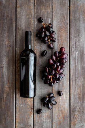 Bottle red wine with bunch of grape. Overhead viewの写真素材