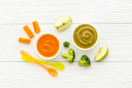 Baby fruit vegetables food - mousse in bowls with fresh vegetables and fruitsの写真素材