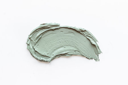 Cosmetic blue clay mask isolated on white background