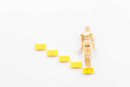 Human mannequin figure on stairs. Developtment and career growthの写真素材
