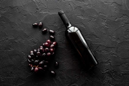 Top view of red wine bottle with grapeの写真素材