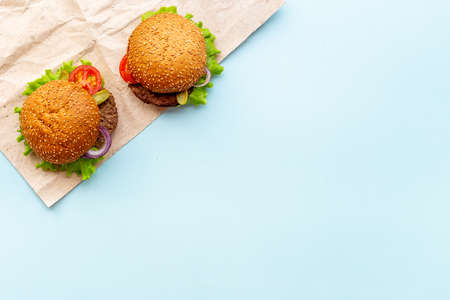 Top view of hamburgers with beef meat steak and vegetalesの写真素材