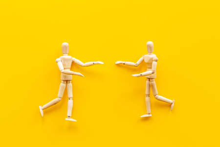 Two wooden figure connection - emotional communication conceptの写真素材
