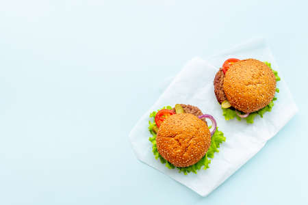 Top view of hamburgers with beef meat steak and vegetalesの写真素材