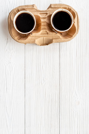 Top view of black coffee in paper cupsの写真素材