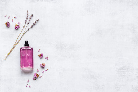 Perfume bottle with aroma flowers and leaves
