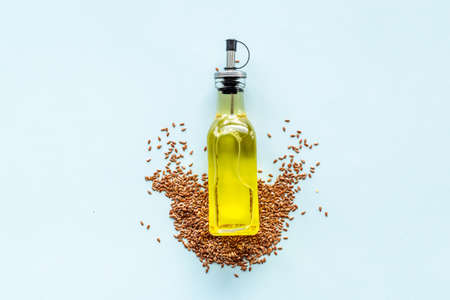 Sesame essence oil in bottle with sesame seeds for food or cosmetic productsの写真素材