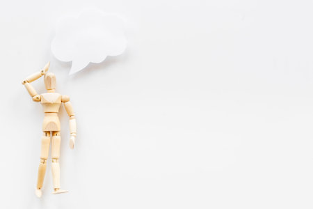 Wooden man figure with speech bubble banner