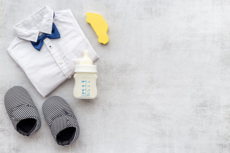 Bodysuit shirt and shoes for baby boy. Baby flat lay background