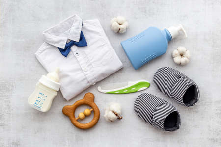 Bodysuit shirt and shoes for baby boy. Baby flat lay backgroundの写真素材