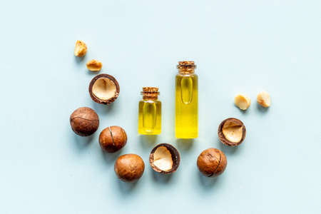 Macadamia essence oil with macadamia nuts. Organic product for food or cosmeticの写真素材