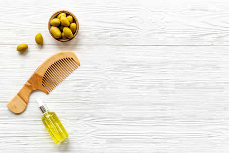 Hair treatment olive oil with hair comb. Top viewの写真素材