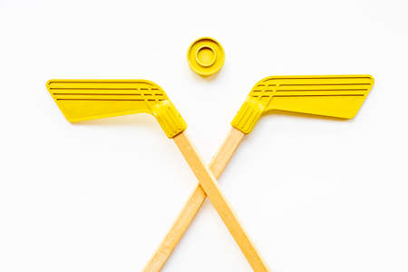 Two hockey sticks and puck. Competitive sports equipmentの写真素材