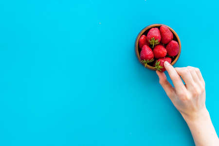 Strawberry flat lay - berries in bowl top viewの写真素材
