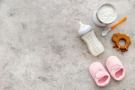 Feeding baby with milk formula - bottle of milk top viewの写真素材