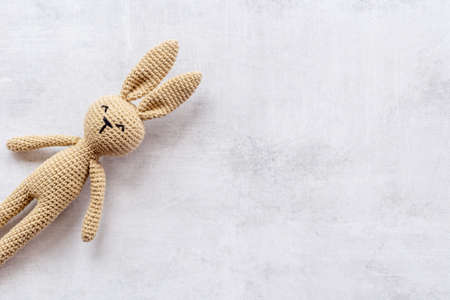 Knitted toy easter bunny for newborn baby or baby showerの写真素材