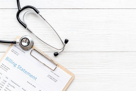 Stethoscope with medical billing statement. Top view