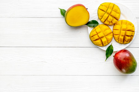 Mango slices and cubes in plate for fresh summer dinnerの写真素材