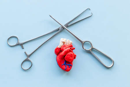 Surgical instruments and heart model. Heart surgery conceptの写真素材
