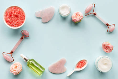 Cosmetics products with gua sha face massage stone and rollerの写真素材