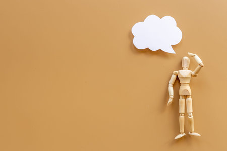 Idea concept. Wooden man figure with speech bubble bannerの写真素材
