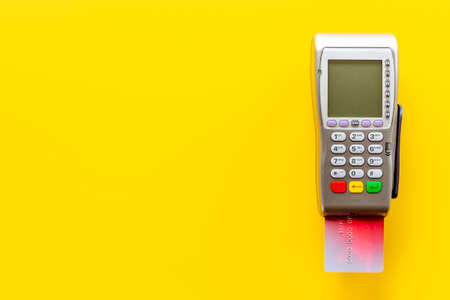 Payment by credit card with POS terminal, top view. E-commerce and payment conceptの写真素材