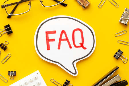 Text faq frequently asked questions on office table with stationeryの写真素材