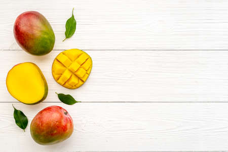 Layout of mango and leaves. Tropical fruits backgroundの写真素材