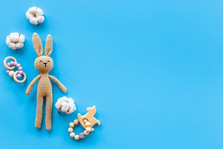 Baby toy rabbit with wooden accessories, overhead viewの写真素材