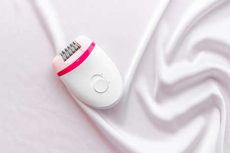 Hair remover epilator on silk for gentle depilationの写真素材