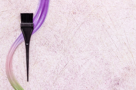 Hairdresser tools for hair dye - brush and strand of hair