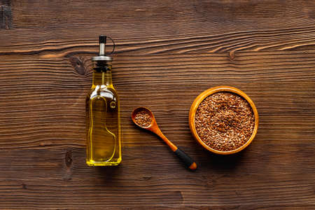 Sesame essence oil in bottle with sesame seeds for food or cosmetic productsの写真素材