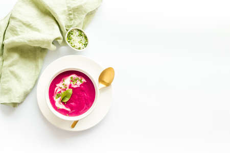 Beet cream soup made of fresh beetroots with sour cream and basilの写真素材