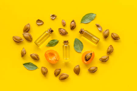 Bottles of apricot kernel oil with ripe apricot fruitsの写真素材